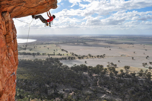 Climber on Kachoong, the classic roof route at Mount Arapiles, Australia.