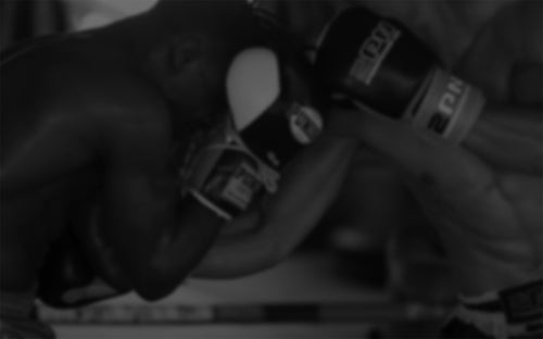 MMA fighters grappling — Rhino skin care for combat sports athletes.