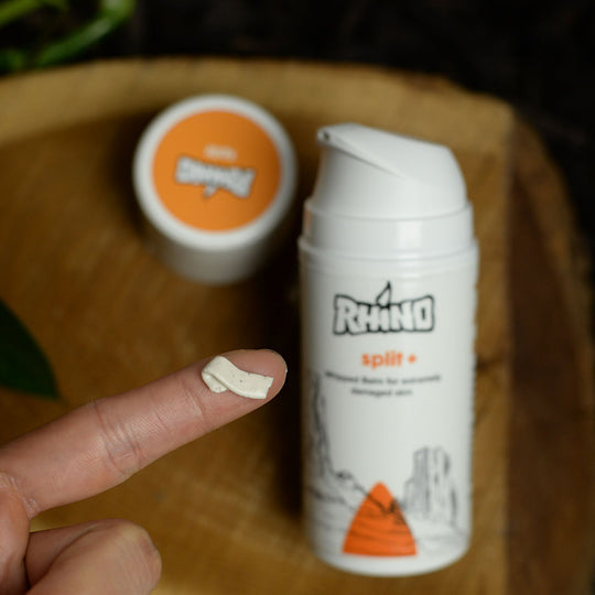 "Split+ by Rhino Skin Solutions being dispensed onto a climber's finger, providing targeted treatment for extreamly damaged skin. Skin Care For Climbers. Skin care for athletes.