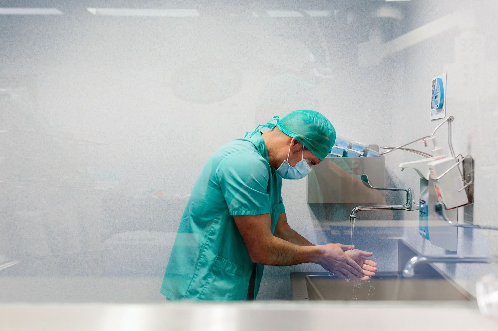 Healthcare worker washing hands — winter hands and working hands skin repair