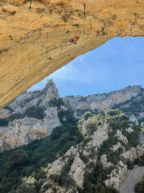 Climber Anak pulling through a roof section — Rhino Skin Solutions athlete.
