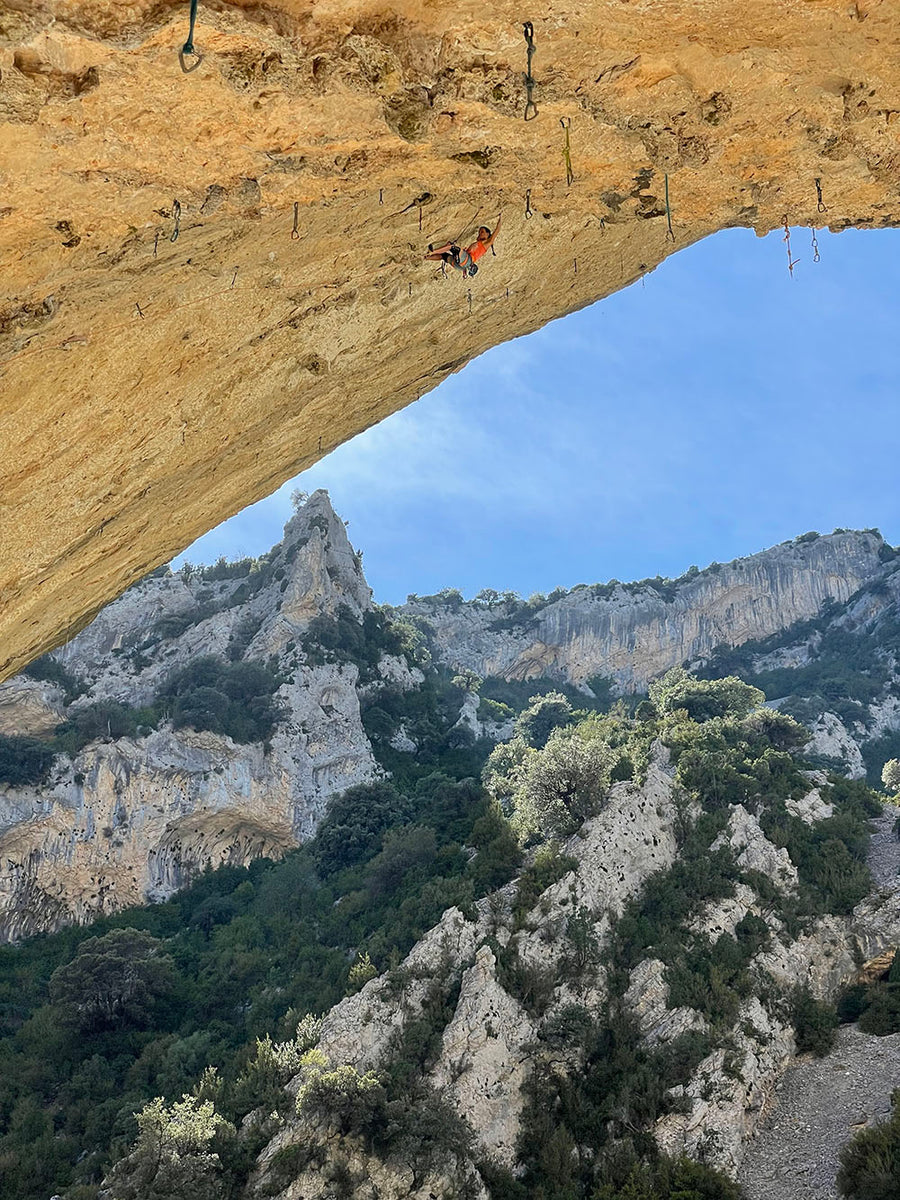 Climber Anak pulling through a roof section — Rhino Skin Solutions athlete.