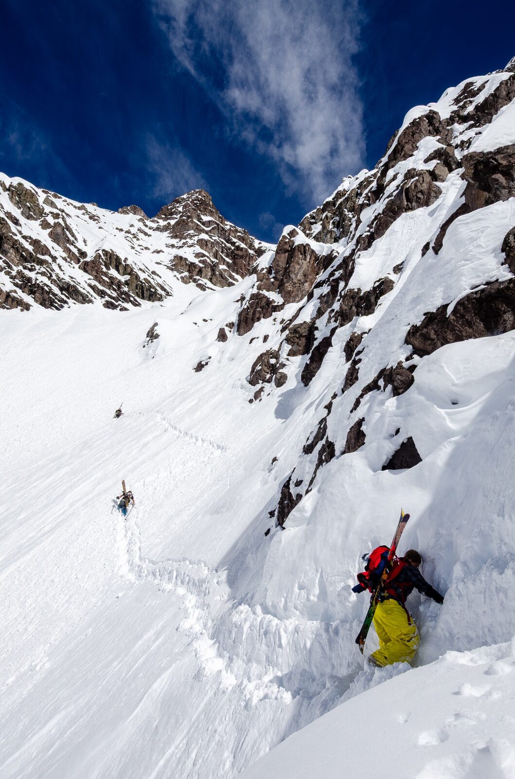 Backcountry skier touring uphill — Rhino skin care for winter sports.