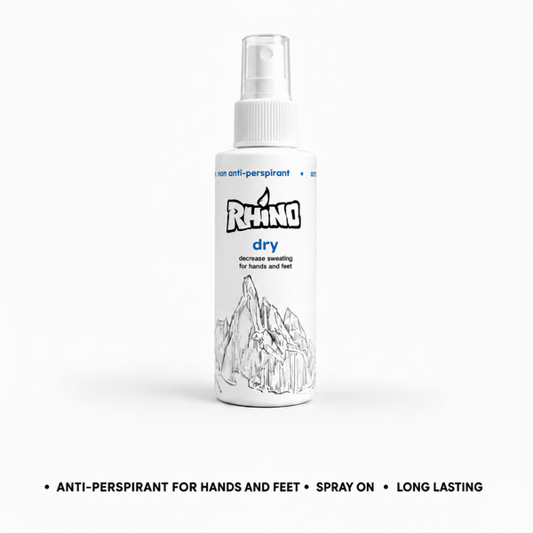 A white spray bottle of Rhino Dry anti-perspirant for hands and feet, shown on a clean white background with blue text below.