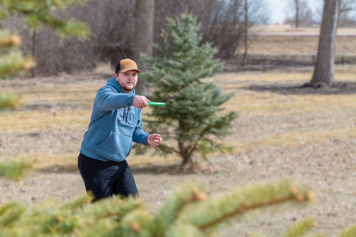 Driving Action
Disc golf player competing at the Disc Golf Pro Tour, powering a long drive down the fairway — supported by Rhino Skin Solutions performance skincare for athletes.