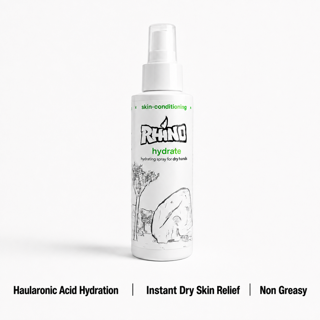 A white spray bottle of Rhino Hydrate skin-conditioning spray for dry hands, shown on a light gray background with text highlighting key benefits at the bottom.