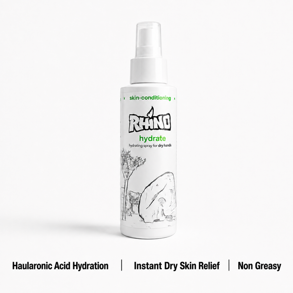 A white spray bottle of Rhino Hydrate skin-conditioning spray for dry hands, shown on a light gray background with text highlighting key benefits at the bottom.