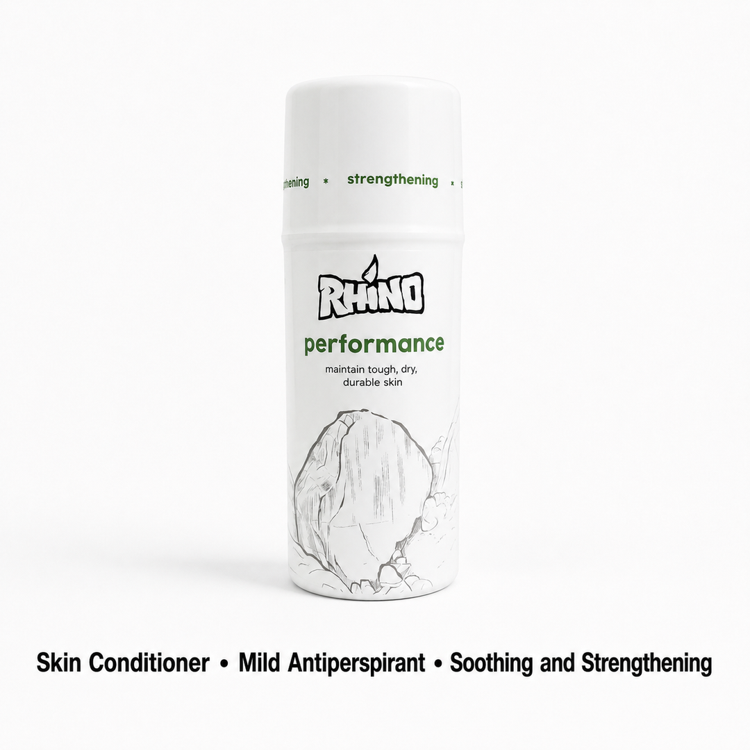 A white cylindrical bottle of Rhino Performance Skin Conditioner with green and black text and a sketch of a rhino horn on the label, shown on a white background with descriptive text below.