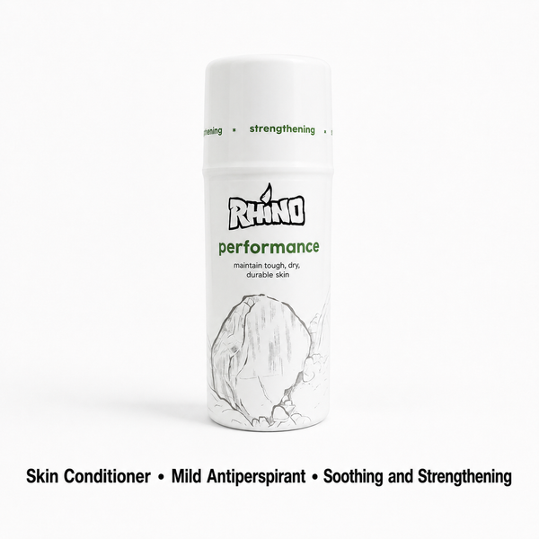 A white cylindrical bottle of Rhino Performance Skin Conditioner with green and black text and a sketch of a rhino horn on the label, shown on a white background with descriptive text below.
