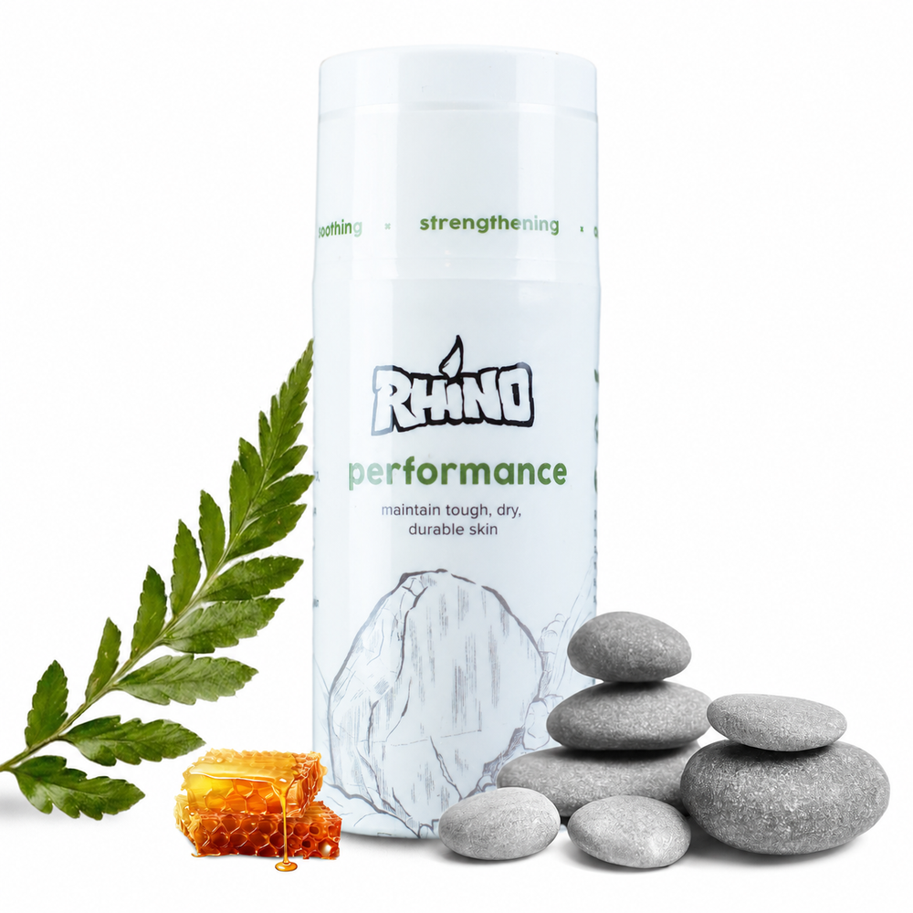 Product packaging with 'Rynno' branding, stones, and a leaf on a white background