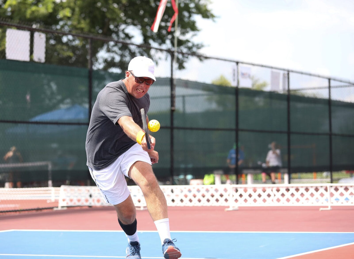 Pickleball players mid-game — Rhino skin care for racquet sports.