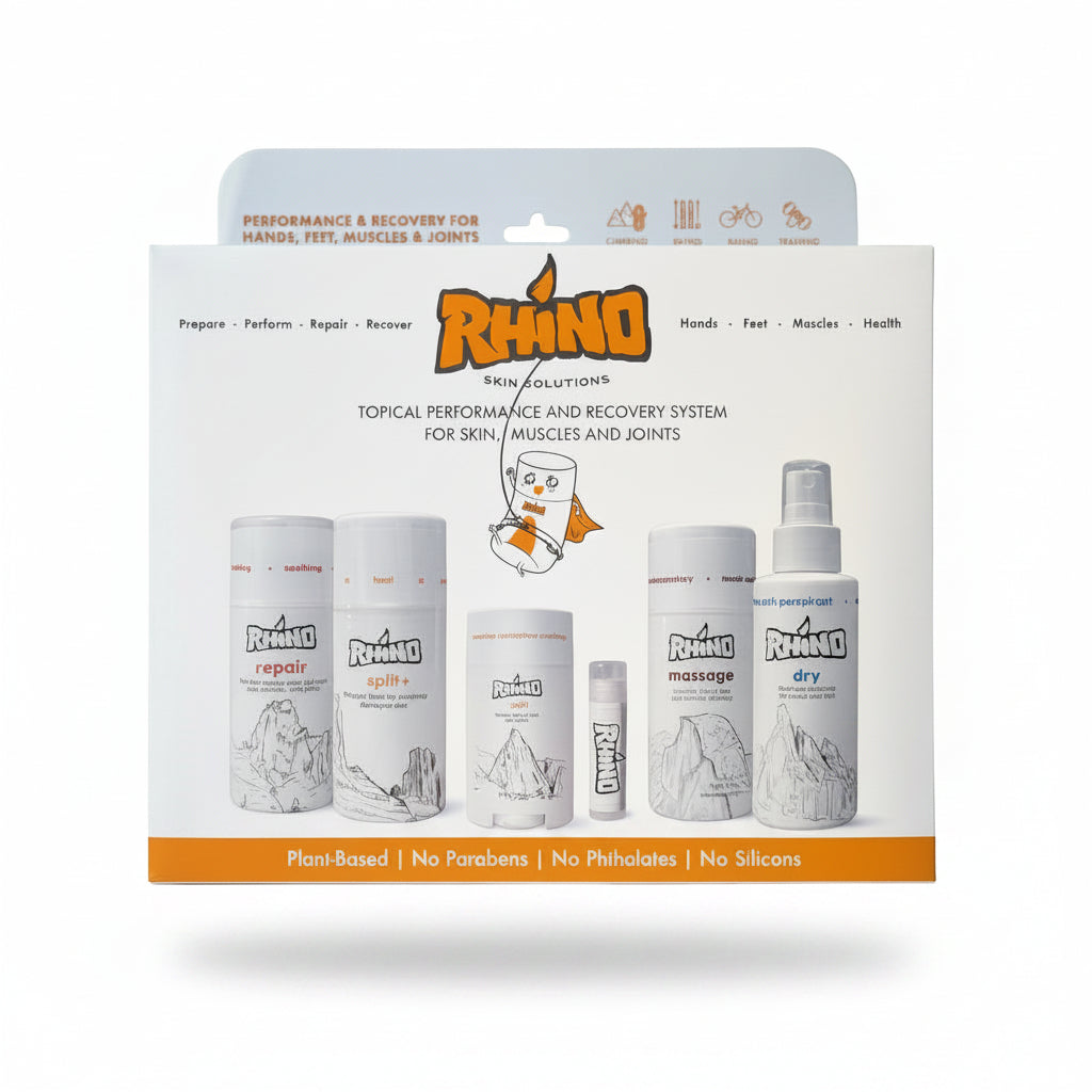 Rhino Skin Solutions topical performance and recovery system in its retail packaging, featuring multiple white bottles and tubes with orange and black branding on a white background.