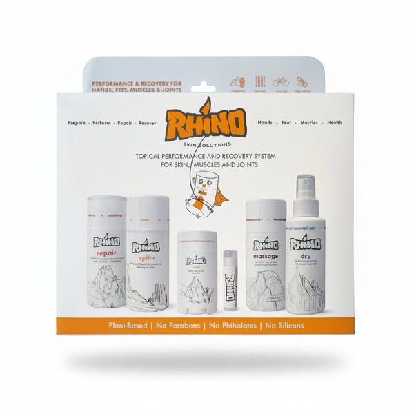 Rhino Skin Solutions topical performance and recovery system in its retail packaging, featuring multiple white bottles and tubes with orange and black branding on a white background.