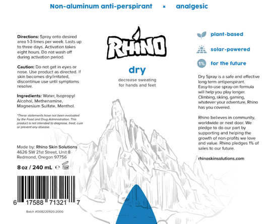 The label for Rhino Dry spray highlights it as a non-aluminum anti-perspirant designed to decrease sweating for hands and feet. The label details directions for use, cautionary advice, and ingredients like methenamine, isopropyl alcohol, and menthol. It emphasizes that the product is plant-based, solar-powered, and part of Rhino Skin Solutions' commitment to sustainability, with 1% of sales pledged to future-focused initiatives. The label also notes the product's long-term effectiveness and suitability for 