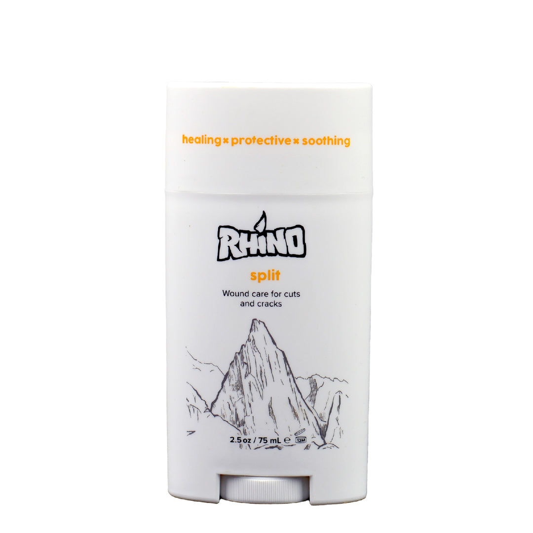 Split Balm by Rhino Skin Solutions in a 2.5 oz oval container with a secure lid, featuring a bold rhino logo. This specialized balm is ideal for rock climbers, athletes, and active individuals, offering natural healing and protection for skin splits, cracks, and abrasions. The smooth, light-colored balm is made with nourishing ingredients to soothe and repair damaged skin, perfect for enhancing hand and skin care routines